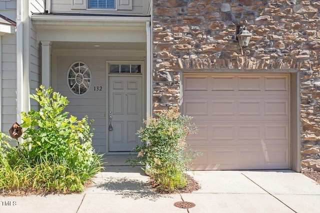 2822 Pickett Rd Unit 132, Durham, NC 27705 - doorway to property featuring a garage and driveway