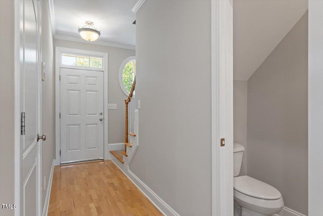2822 Pickett Rd Unit 132, Durham, NC 27705 - foyer entrance with baseboards, ornamental molding, light wood-type flooring, and stairs