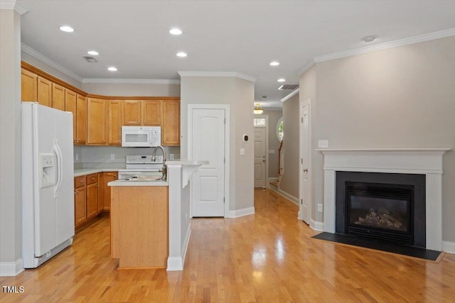 2822 Pickett Rd Unit 132, Durham, NC 27705 - kitchen featuring white appliances, light countertops, light wood finished floors, an island with sink, and recessed lighting