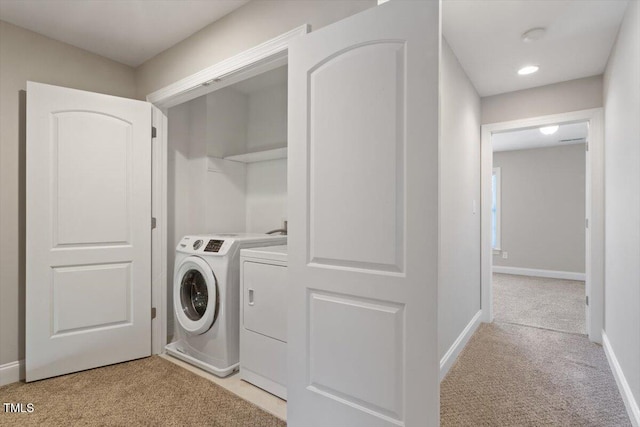 2822 Pickett Rd Unit 132, Durham, NC 27705 - laundry room featuring light carpet, washing machine and clothes dryer, and baseboards