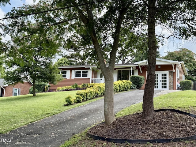 2909 Sprucewood Dr, Durham, NC 27707 - ranch-style home featuring french doors and a front lawn