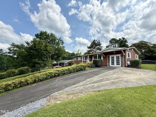 2909 Sprucewood Dr, Durham, NC 27707 - single story home featuring french doors and concrete driveway