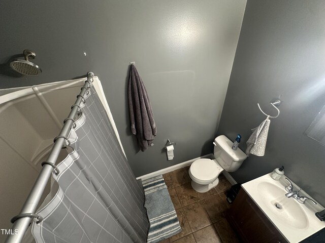 2509 Chapel Hill Rd, Durham, NC 27707 - full bath featuring tile patterned floors, toilet, vanity, baseboards, and a tub