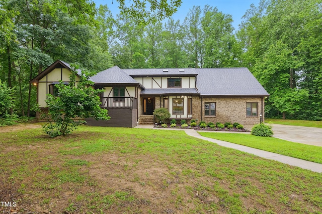 6617 Whitted Rd, Fuquay Varina, NC 27526 - view of front of property with a front yard, brick siding, and covered porch