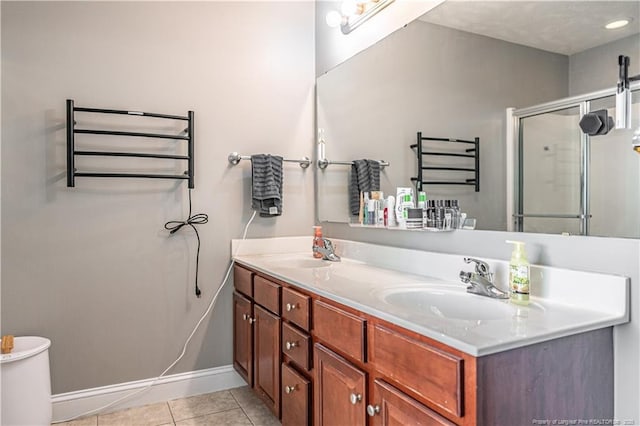 191 Trenton Pl, Cameron, NC 28326 - full bathroom with a towel warmer, double vanity, tile patterned flooring, and a stall shower
