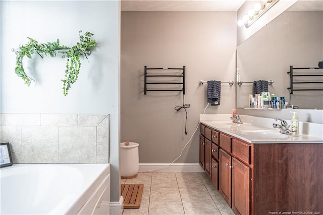 191 Trenton Pl, Cameron, NC 28326 - bathroom with a garden tub, double vanity, a towel warmer, tile patterned flooring, and baseboards