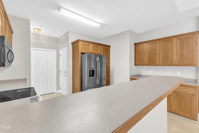 103 Kylie Savannah Ct, Cary, NC 27511 - kitchen with appliances with stainless steel finishes, brown cabinetry, and light countertops