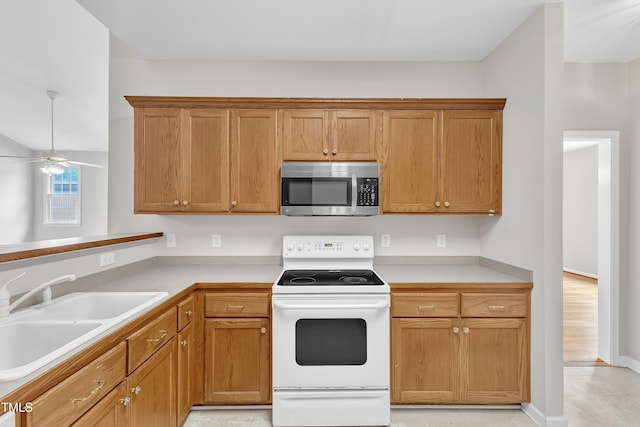 103 Kylie Savannah Ct, Cary, NC 27511 - kitchen featuring stainless steel microwave, white electric range oven, a sink, a ceiling fan, and light countertops