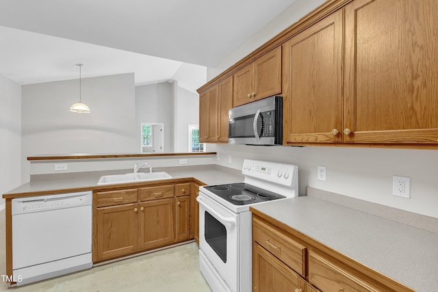 103 Kylie Savannah Ct, Cary, NC 27511 - kitchen with white appliances, a sink, brown cabinetry, light countertops, and lofted ceiling