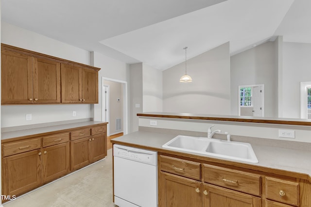 103 Kylie Savannah Ct, Cary, NC 27511 - kitchen featuring white dishwasher, a sink, brown cabinetry, hanging light fixtures, and vaulted ceiling