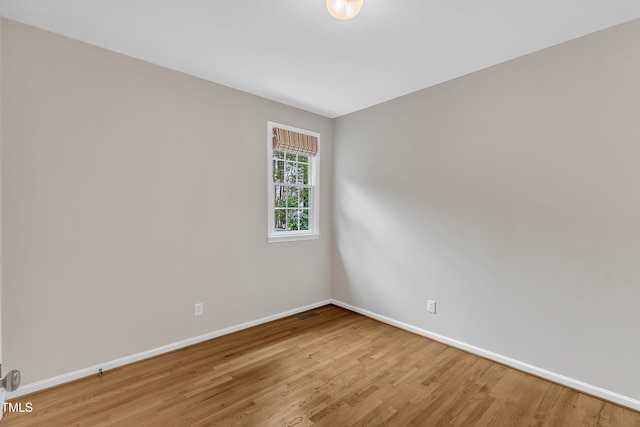 103 Kylie Savannah Ct, Cary, NC 27511 - spare room featuring baseboards and wood finished floors