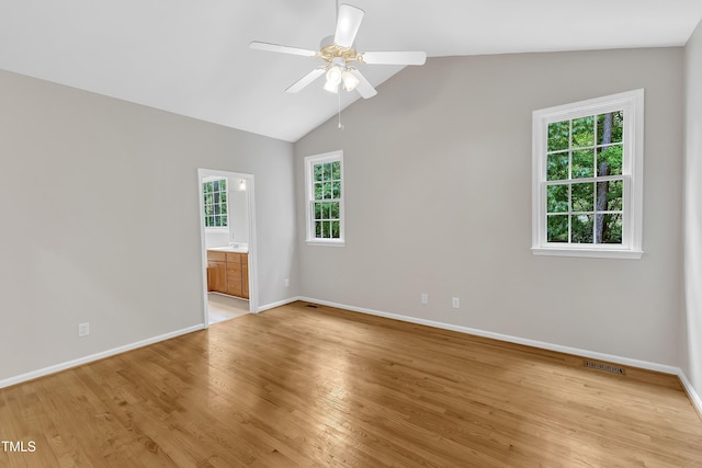 103 Kylie Savannah Ct, Cary, NC 27511 - empty room featuring plenty of natural light, ceiling fan, baseboards, light wood-style flooring, and vaulted ceiling