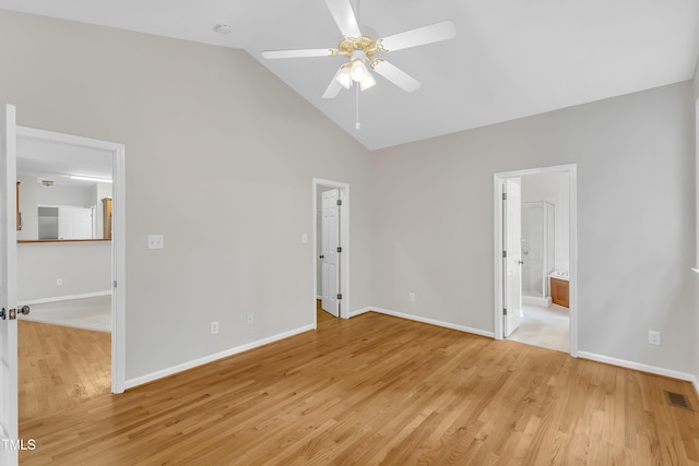 103 Kylie Savannah Ct, Cary, NC 27511 - unfurnished bedroom featuring light wood-style floors, baseboards, high vaulted ceiling, and connected bathroom