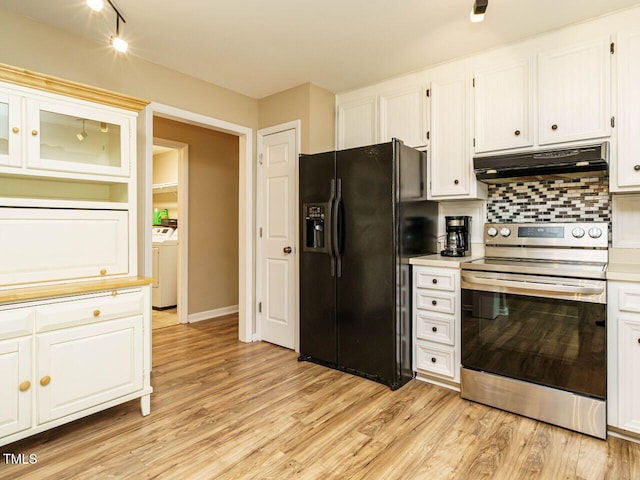 8204 Charlbert Ct, Apex, NC 27539 - kitchen featuring black refrigerator with ice dispenser, stainless steel range with electric stovetop, under cabinet range hood, white cabinets, and decorative backsplash