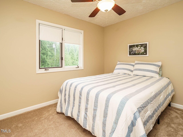 8204 Charlbert Ct, Apex, NC 27539 - carpeted bedroom with a textured ceiling, baseboards, and a ceiling fan