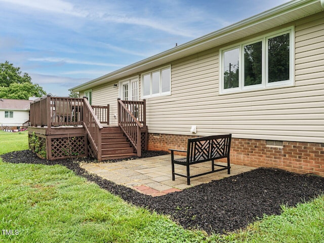 8204 Charlbert Ct, Apex, NC 27539 - rear view of house featuring crawl space, a wooden deck, a patio area, and a yard