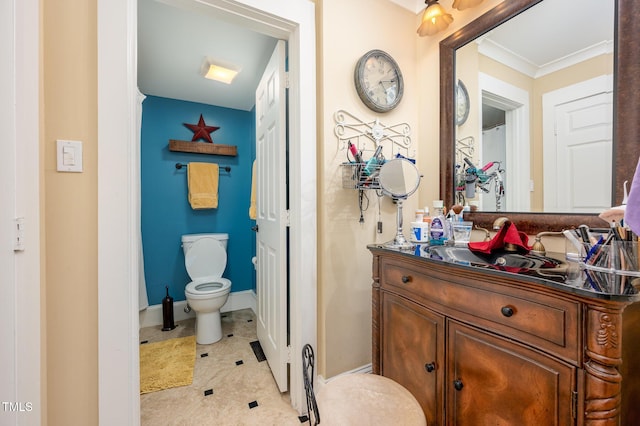 6035 Sentinel Dr, Raleigh, NC 27609 - full bath with vanity, toilet, ornamental molding, and tile patterned flooring