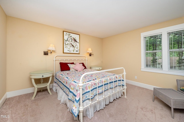 6035 Sentinel Dr, Raleigh, NC 27609 - carpeted bedroom featuring baseboards