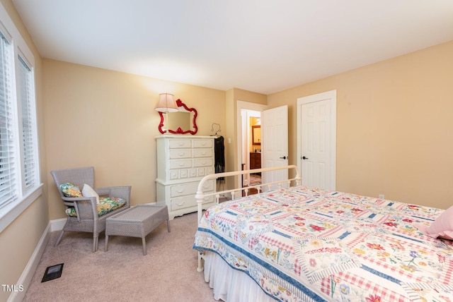 6035 Sentinel Dr, Raleigh, NC 27609 - bedroom featuring light carpet and baseboards