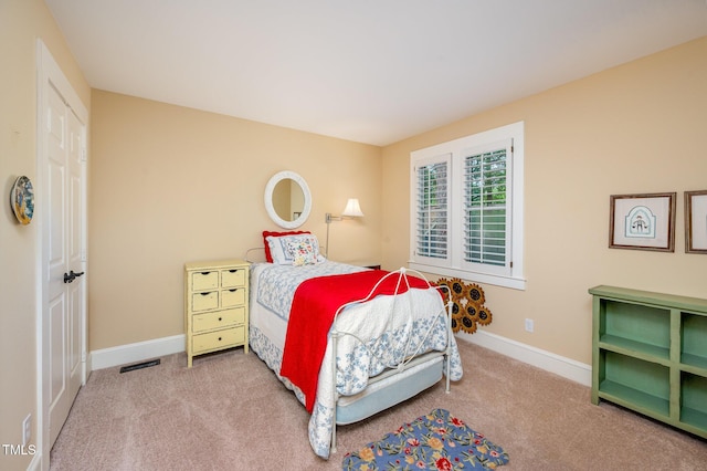 6035 Sentinel Dr, Raleigh, NC 27609 - carpeted bedroom with baseboards