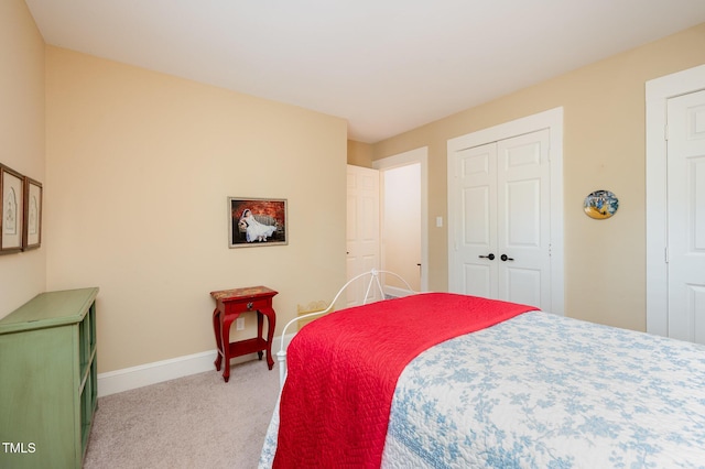 6035 Sentinel Dr, Raleigh, NC 27609 - bedroom featuring light colored carpet, baseboards, and a closet