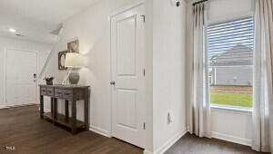 2132 Monk Dr, Haw River, NC 27258 - hall featuring dark wood finished floors and baseboards