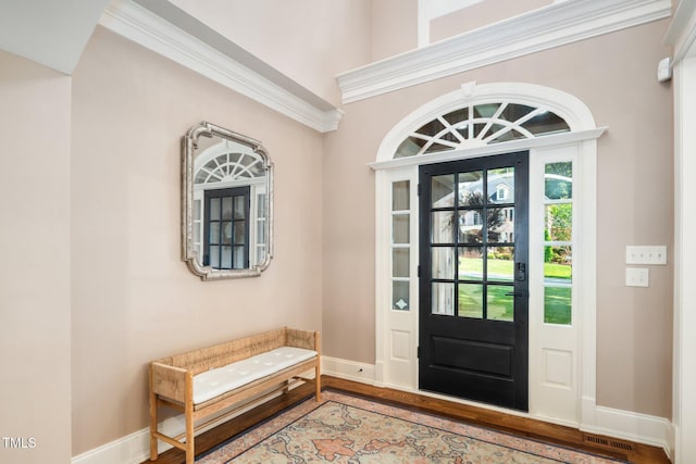 3748 Westbury Lake Dr, Raleigh, NC 27603 - foyer entrance featuring wood finished floors and ornamental molding