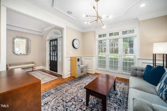 3748 Westbury Lake Dr, Raleigh, NC 27603 - living room featuring crown molding, a chandelier, wood finished floors, a wainscoted wall, and recessed lighting