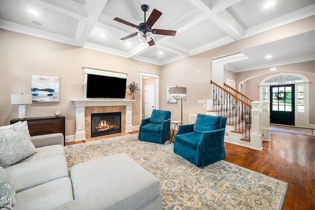 3748 Westbury Lake Dr, Raleigh, NC 27603 - living room featuring wood finished floors, a ceiling fan, a fireplace with flush hearth, coffered ceiling, and beamed ceiling