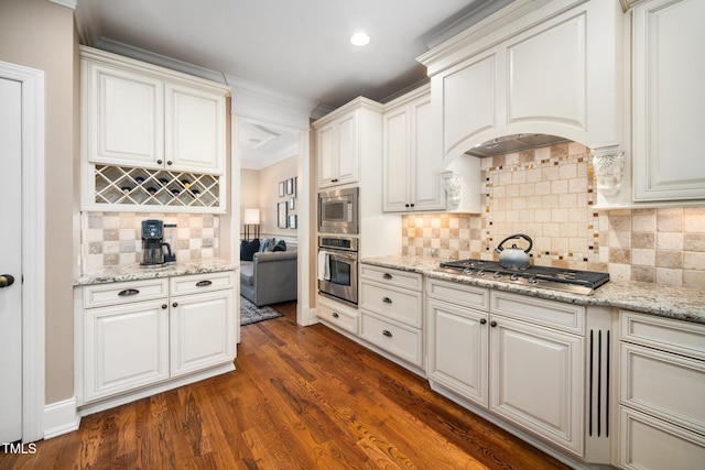3748 Westbury Lake Dr, Raleigh, NC 27603 - kitchen featuring stainless steel appliances, tasteful backsplash, dark wood-type flooring, light stone counters, and recessed lighting