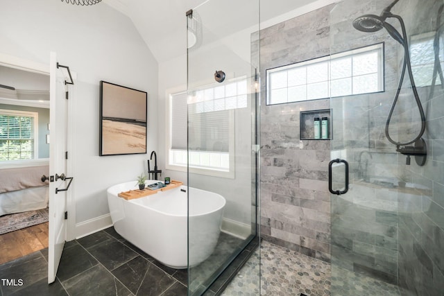3748 Westbury Lake Dr, Raleigh, NC 27603 - bathroom with connected bathroom, a shower stall, a soaking tub, and vaulted ceiling