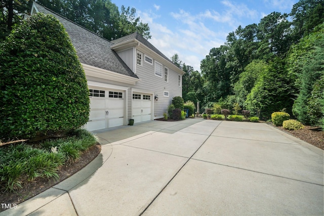 3748 Westbury Lake Dr, Raleigh, NC 27603 - view of side of home with driveway and a shingled roof