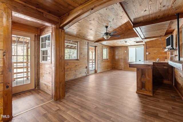 5437 Grasshopper Rd, Raleigh, NC 27610 - kitchen with wooden walls, wood ceiling, wood finished floors, ceiling fan, and open floor plan