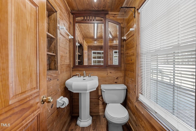 5437 Grasshopper Rd, Raleigh, NC 27610 - bathroom with wood walls, toilet, wood ceiling, wood finished floors, and a sink