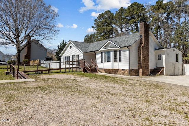 5437 Grasshopper Rd, Raleigh, NC 27610 - view of front facade with crawl space, a chimney, and roof with shingles