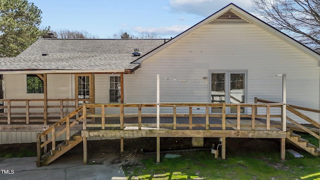 5437 Grasshopper Rd, Raleigh, NC 27610 - rear view of property featuring stairway, a shingled roof, a wooden deck, and a chimney
