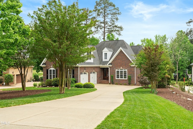 498 Mountain Laurel, Chapel Hill, NC 27517 - traditional-style home featuring concrete driveway, brick siding, a front yard, and a garage