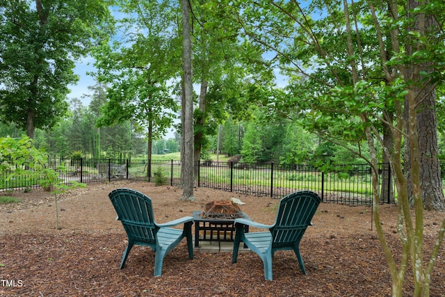 498 Mountain Laurel, Chapel Hill, NC 27517 - view of yard with a fire pit and view of wooded area