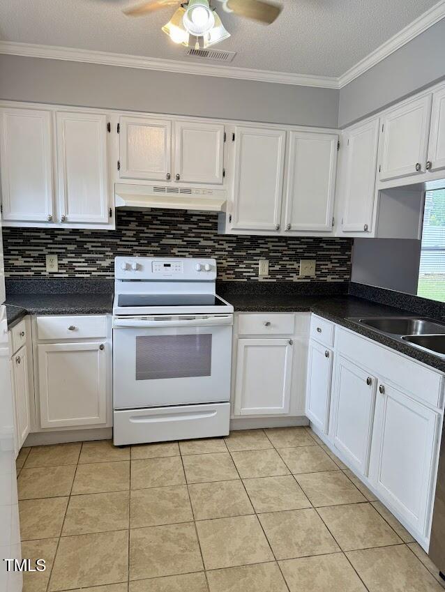 5071 Avenida Del Sol Dr, Raleigh, NC 27616 - kitchen featuring white electric range oven, under cabinet range hood, white cabinets, ornamental molding, and a textured ceiling