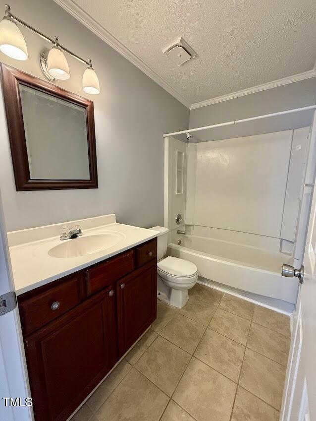 5071 Avenida Del Sol Dr, Raleigh, NC 27616 - full bath with ornamental molding, vanity, a textured ceiling, tile patterned flooring, and bathtub / shower combination