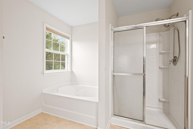 1405 Merrilow Ct, Wake Forest, NC 27587 - bathroom featuring a shower stall, a bath, and baseboards