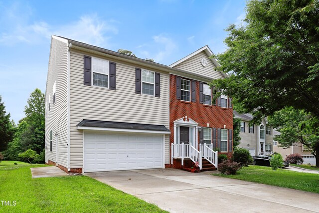 1405 Merrilow Ct, Wake Forest, NC 27587 - view of front of home with a garage, concrete driveway, and a front lawn
