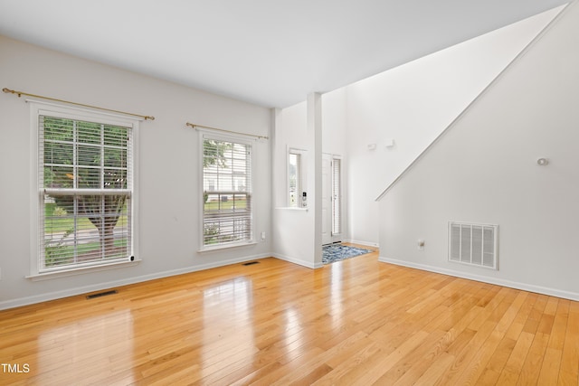 1405 Merrilow Ct, Wake Forest, NC 27587 - unfurnished living room with wood-type flooring and baseboards