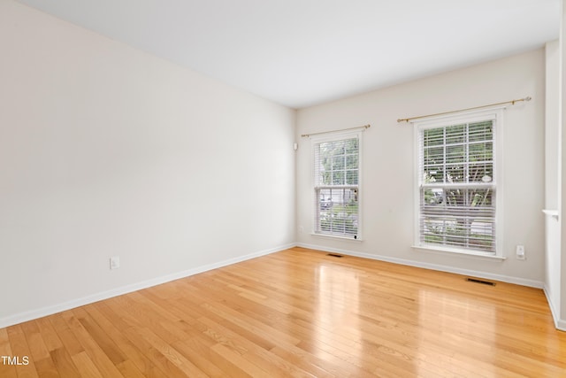 1405 Merrilow Ct, Wake Forest, NC 27587 - empty room featuring light wood-type flooring and baseboards