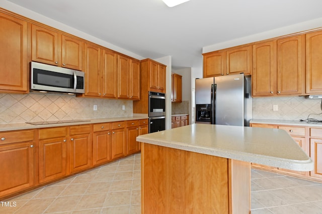 1405 Merrilow Ct, Wake Forest, NC 27587 - kitchen with stainless steel appliances, backsplash, light countertops, light tile patterned flooring, and a kitchen island
