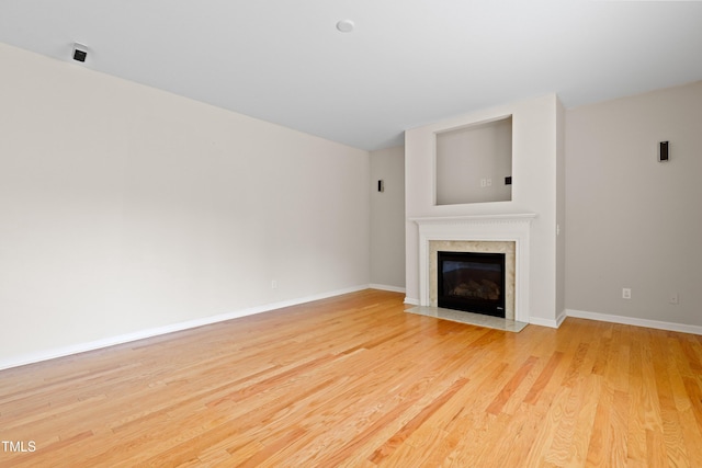 1405 Merrilow Ct, Wake Forest, NC 27587 - unfurnished living room featuring light wood-style flooring, a fireplace, and baseboards