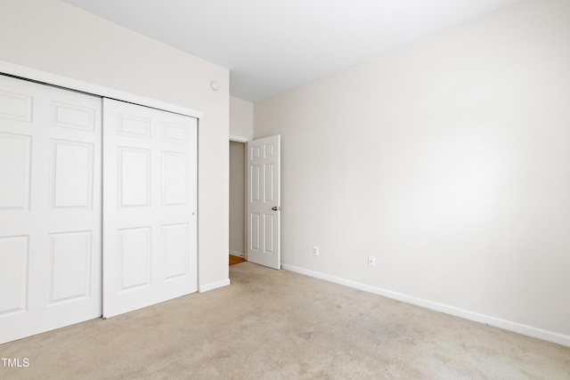 1405 Merrilow Ct, Wake Forest, NC 27587 - unfurnished bedroom featuring carpet flooring, a closet, and baseboards