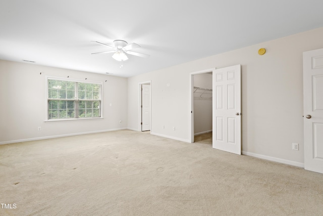 1405 Merrilow Ct, Wake Forest, NC 27587 - unfurnished bedroom with a walk in closet, light colored carpet, and baseboards
