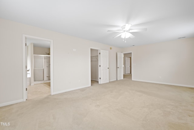 1405 Merrilow Ct, Wake Forest, NC 27587 - unfurnished bedroom featuring a walk in closet, light colored carpet, baseboards, a closet, and ensuite bathroom