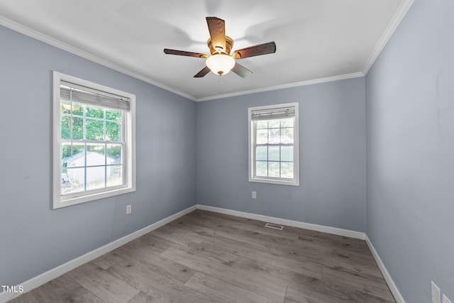 282 Cooke Rd, Louisburg, NC 27549 - unfurnished room with healthy amount of natural light, wood finished floors, ceiling fan, and ornamental molding